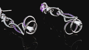 
                
                    Load and play video in Gallery viewer, Advay earrings in spirals of diamonds and purple sapphires.
                
            